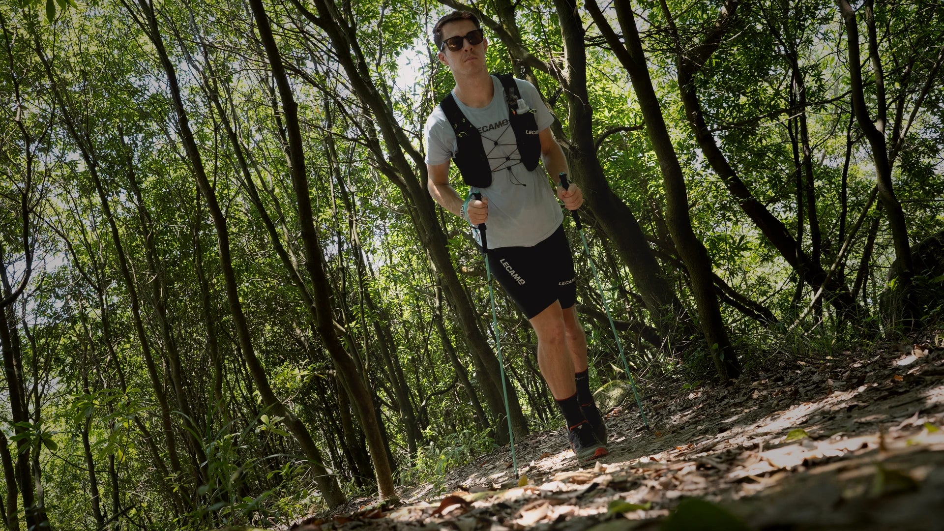 LECAMO runner crossing exposed mountain terrain