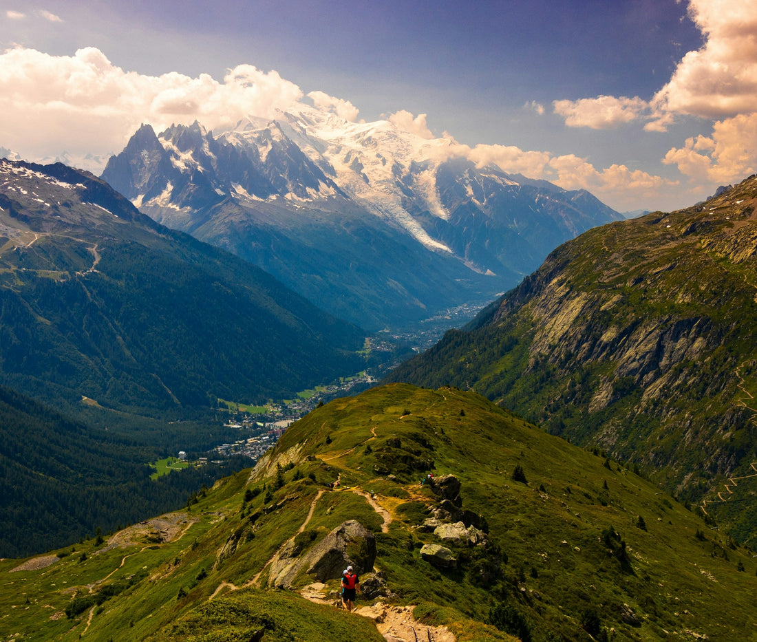 Distant trail runners on a ridge above Chamonix with Mont Blanc beyond