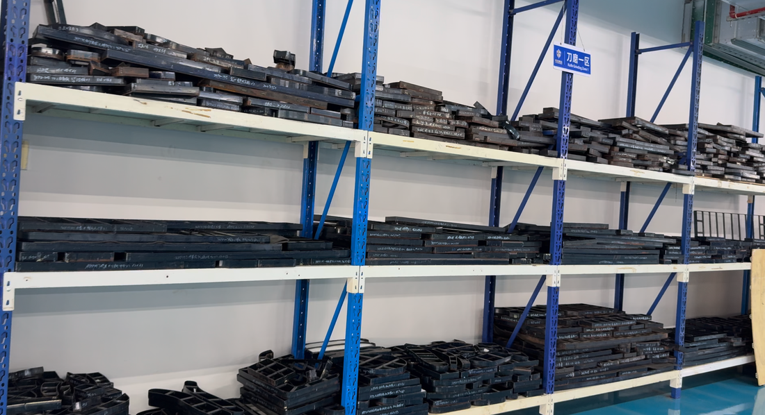 Shaped cutting tools stored on racks in a production area