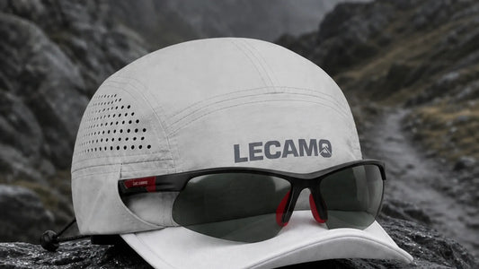 LECAMO trail running hat and sunglasses on a wet mountain trail
